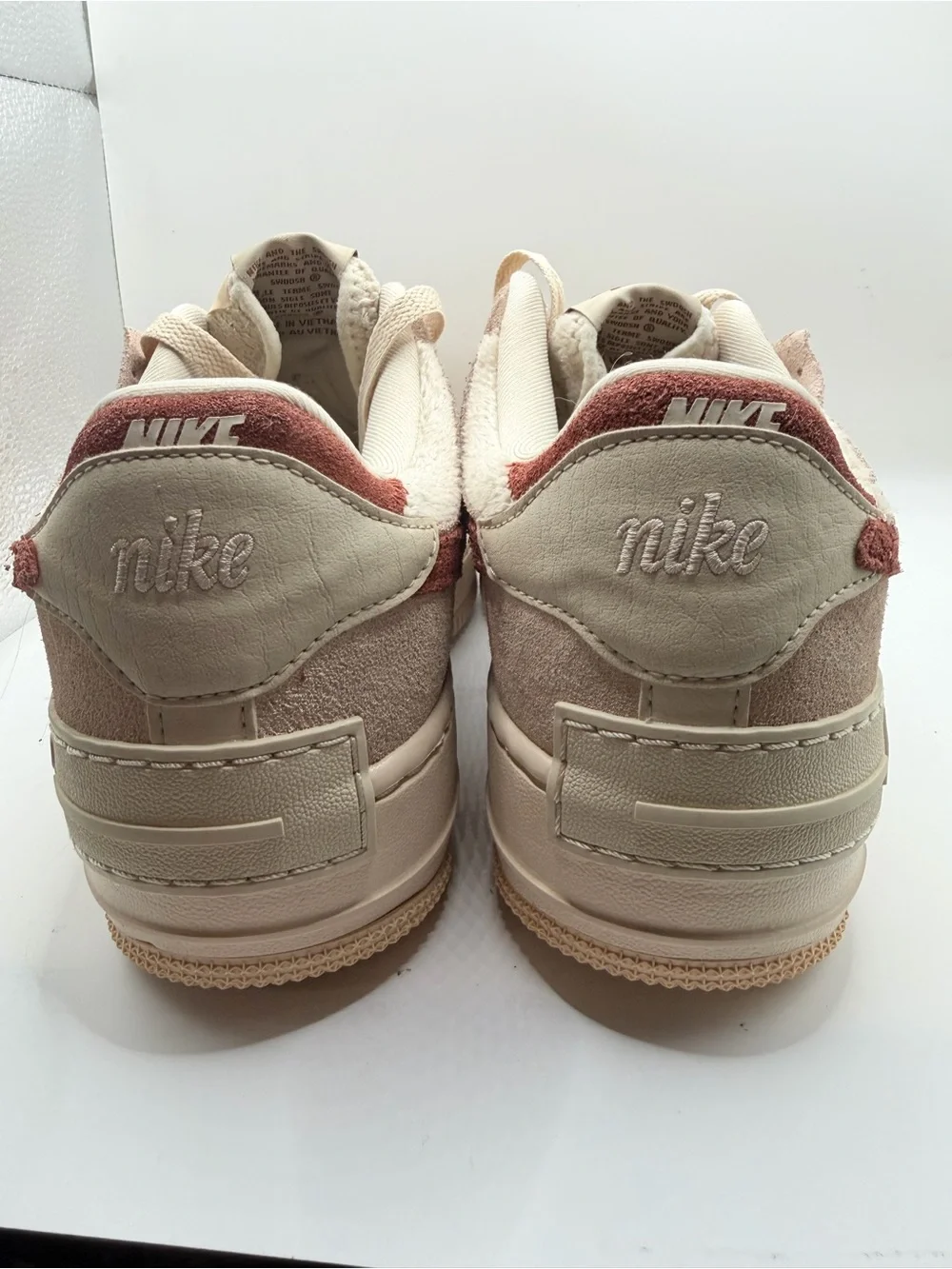 Nike Women's Low-Top Sneakers in Cream with Rust Swoosh